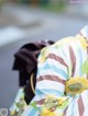 A close up of a bag with sunflowers on it.